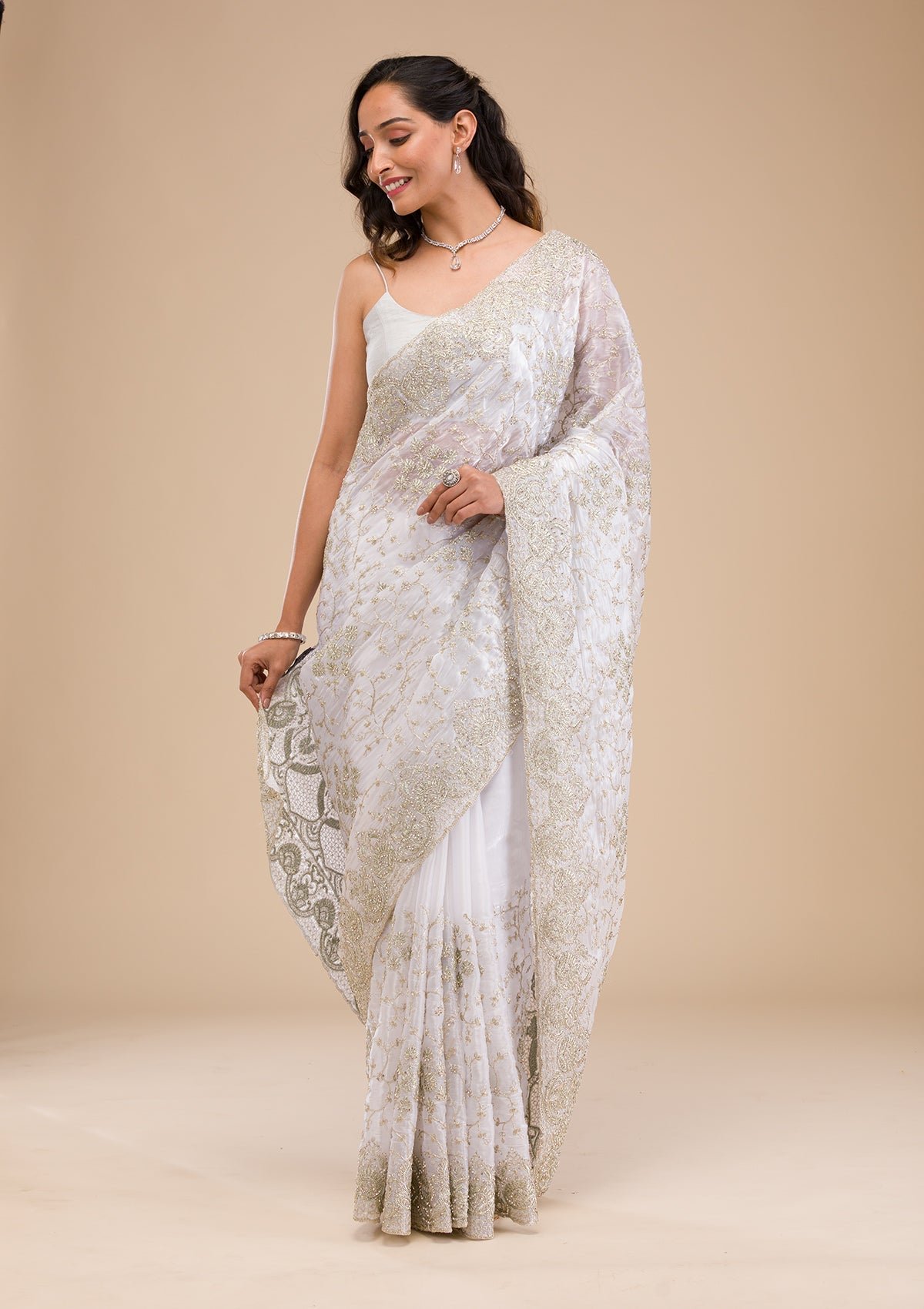 Elegant Off White Tissue Saree with Exquisite Zariwork