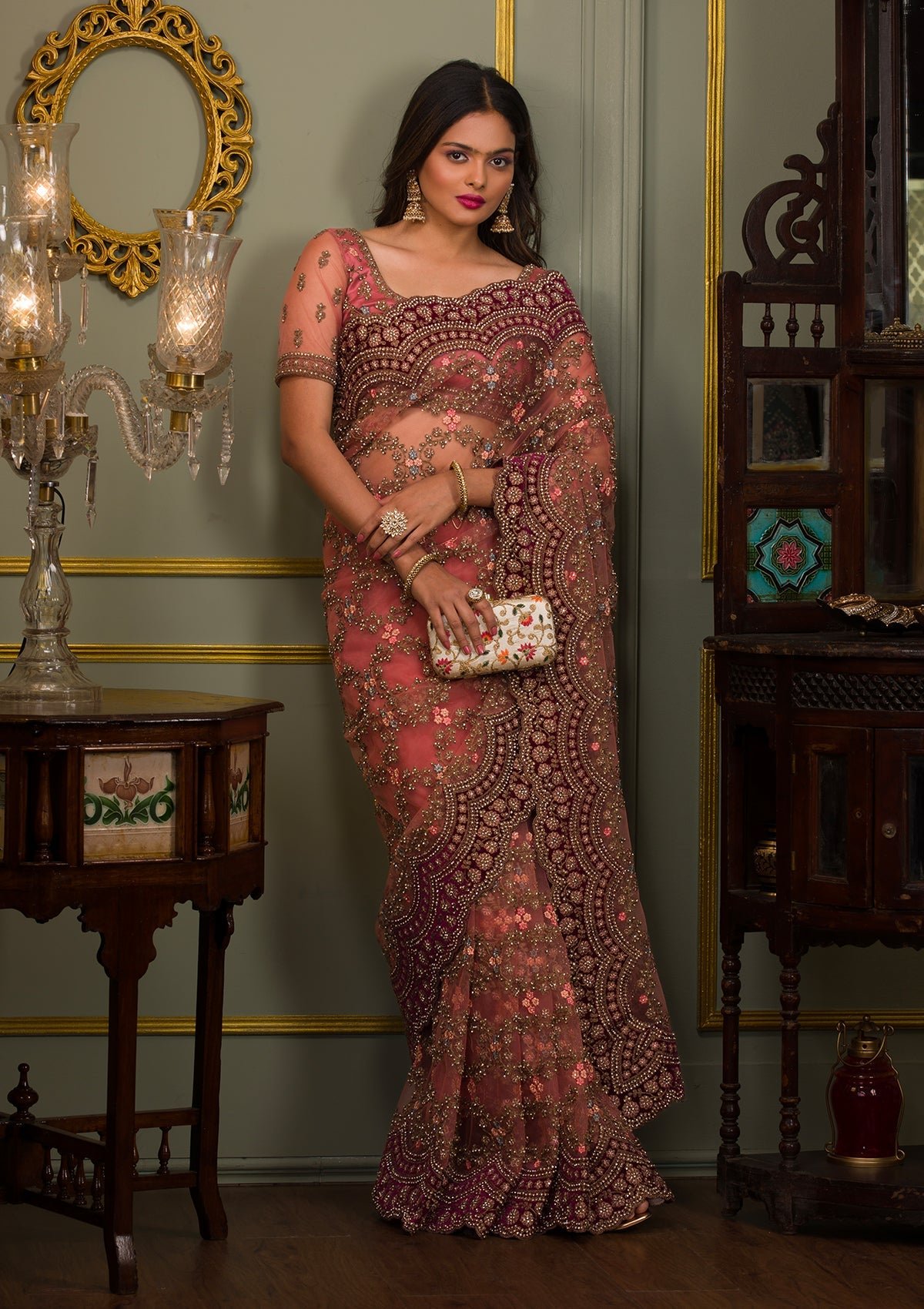 Elegant Peach Net Saree with Stonework Accents